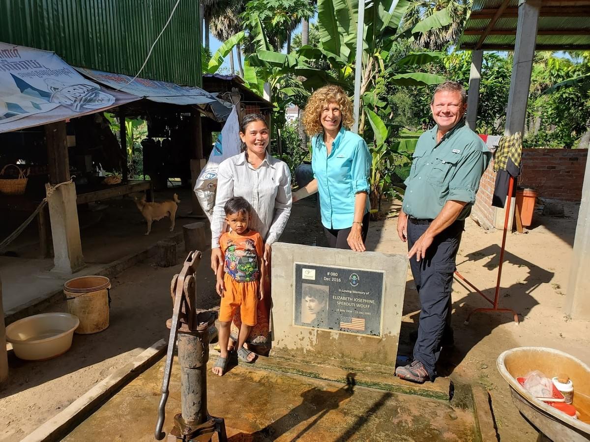 Mark & Trina visiting the recipients of one of the 1st water wells they donated in Camobodia. This well was dedicated in loving memory of Trina & Lisa's mother, Elizabeth Sperduti Wolff Mark & Trina visiting the recipients of one of the 1st water wells they donated in Camobodia. This well was dedicated in loving memory of Trina & Lisa's mother, Elizabeth Sperduti Wolff