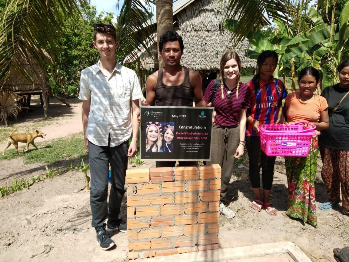 Holly celebrating her achievement by visiting the Cambodian family that received a water well dedicated to both sisters aquiring their graduate degrees. Holly celebrating her achievement by visiting the Cambodian family that received a water well dedicated to both sisters aquiring their graduate degrees.