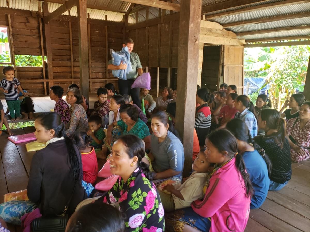 Mark distributing mosquito nets to Cambodian villagers Mark distributing mosquito nets to Cambodian villagers