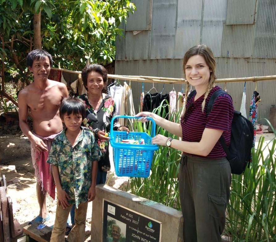 Gifting the Cambodian family that received a water well dedicated to her grandfather, John Wolff. Gifting the Cambodian family that received a water well dedicated to her grandfather, John Wolff.