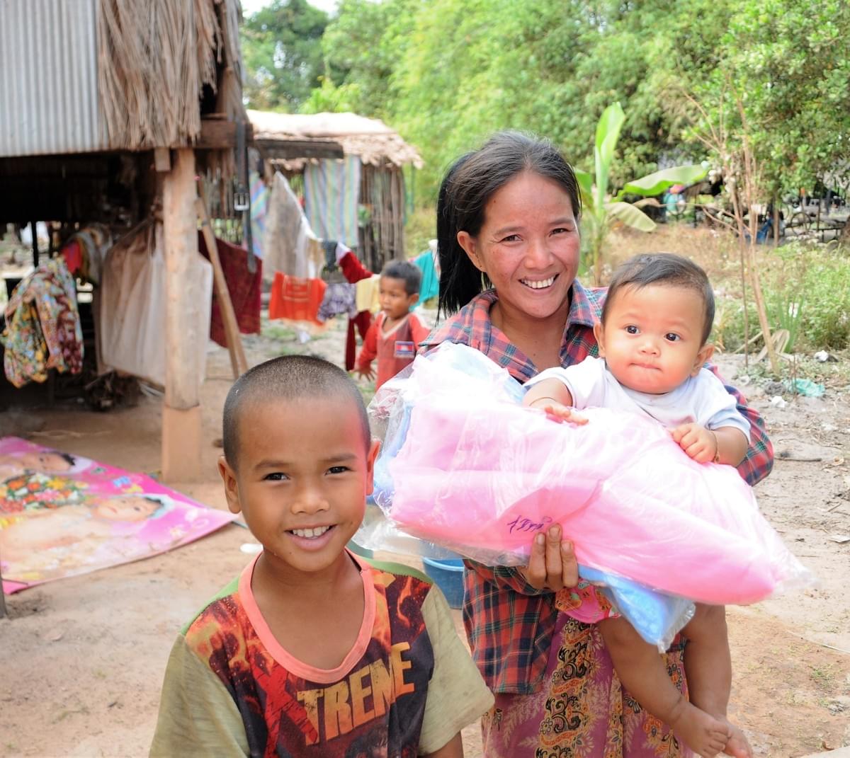 A mother & young children in Cambodia gratefully accept mosquito nets to aid in protecting them from Malaria (donated by MTRF) A mother & young children in Cambodia gratefully accept mosquito nets to aid in protecting them from Malaria (donated by MTRF)